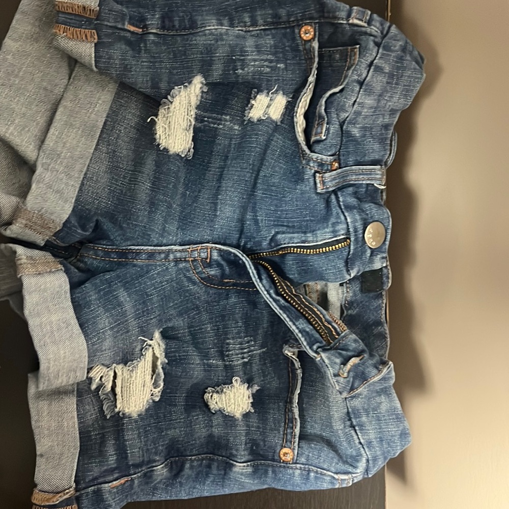 Dark jean shorts. Work a couple times. They have shrunk a little bit